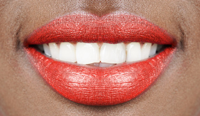 beautiful smile african woman mouth lips with red lipstick and white teeth
