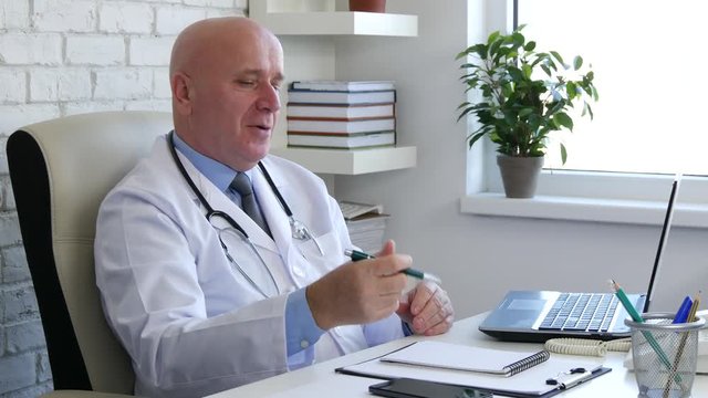 Doctor Image in Hospital Cabinet Talking with a Patient
