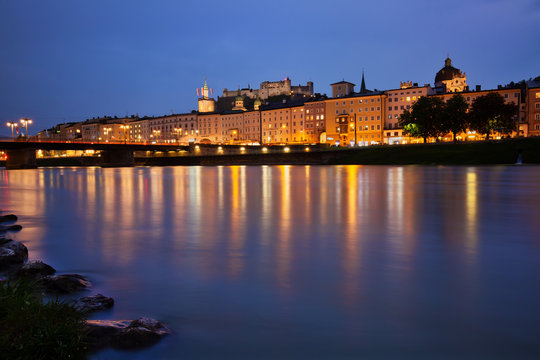 SALZBURG, AUSTRIA - May 4th, 2018: View to Salzburg old town and Hohensalzburg Fortress across Salzach river on a spring evening