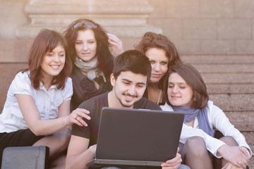 Fototapeta na wymiar closeup. groups of students with a laptop