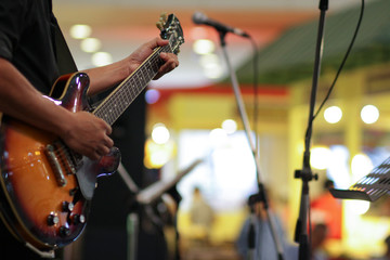 guitarist on stage for background,soft and blur , selective focus, music and sound concept.