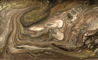 Gold marbling texture design. Beige and golden marble pattern. Fluid art.