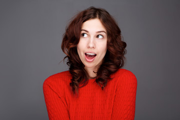 Fototapeta premium Close up young woman with amazed expression on face