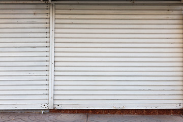 Metal roller shutter door of store closed