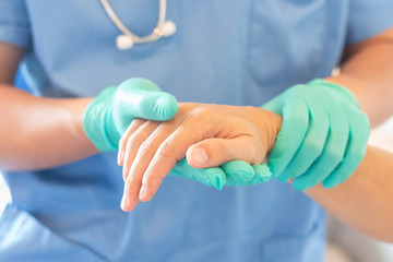 Surgeon, surgical doctor, anesthetist or anesthesiologist holding patient's hand for health care trust and support in professional ER surgical operation, medical anesthetic safety, healthcare concept