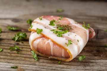 Goat cheese wrapped in slice of smoked bacon