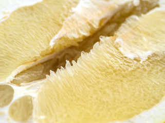 Detail of pomelo fruit. Macro with shallow depth of filed.