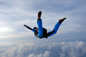 Skydiving. Girl is in the sky.