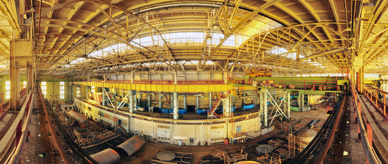 Abandoned plant in sunset light. Panorama 180 degrees.