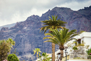 Fototapeta na wymiar 10 of May 2018 - Tenerife, Spain. Cityscape view of Los Gigantes cliffs