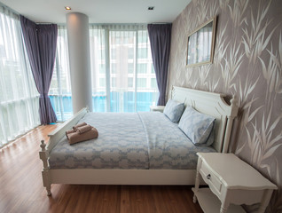 Beautiful bedroom interior and towels