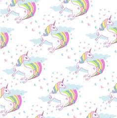 Seamless pattern with cute unicorns and rainbow