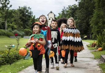 Rolgordijnen Young kids trick or treating during Halloween © Rawpixel.com