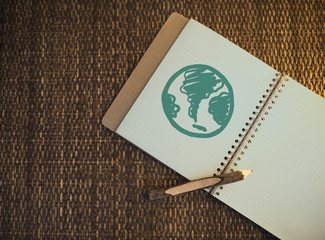 Green globe written on a notebook