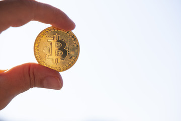 Fototapeta na wymiar bitcoin in hand on white background