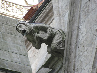 Statues of mythological creatures, chimeras, gargoyles and others on the walls of ancient buildings