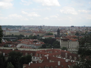 Fototapeta na wymiar Panorama of Prague, view of the city roofs and domes of churches