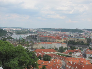 Fototapeta premium Panorama of Prague, view of the city roofs and domes of churches
