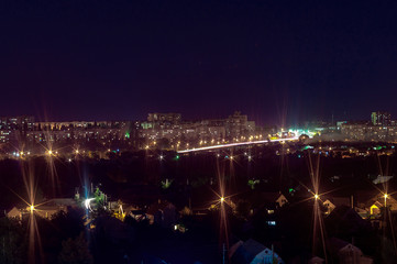 Long exposure night photo. A lot of lights symbolized Big city life at night. Night city illumination. Night cityscape.