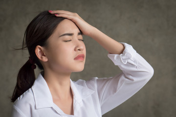 portrait of stressed and sick woman with headache; ill woman suffers from stress, vertigo,...