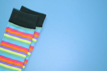 Fun colorful socks in a Pastel background with copy space.