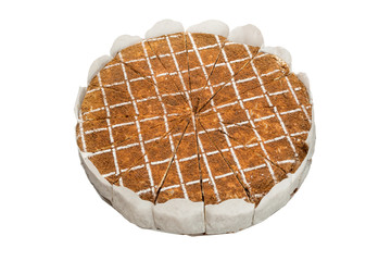 Dark chocolate vegan cake with candies and nuts on white background