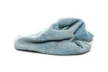 Dirty blue crumpled microfiber cloth isolated on white background