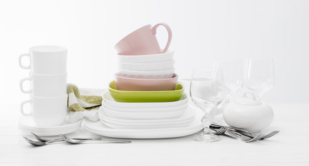 Pile of colourful square dishes and cups