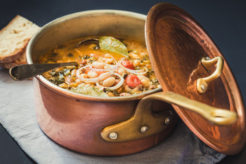 Soup with different vegetables and legumes, typical tuscan soup, ribollita.