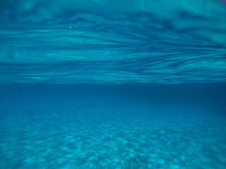Sea level underwater photo of tropical caribbean paradise turquoise beach in exotic island located...