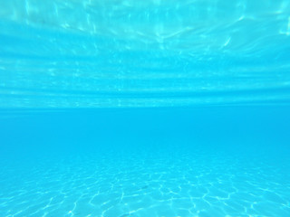 Underwater photo of tropical paradise turquoise exotic beach of Voutoumi with sail boats docked in island of Antipaxos, Ionian, Greece