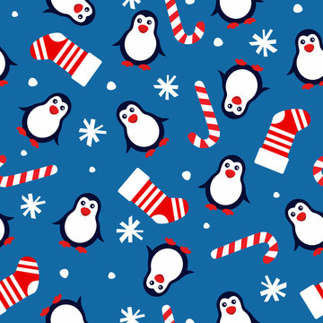 new year seamless background with penguins, christmas socks, candy cane and snowflakes on a blue background