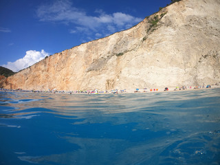 Sea level underwater photo of tropical caribbean paradise turquoise beach in exotic island located in an ocean
