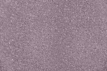 The texture of painted design purple wall. Plaster wall background.