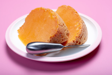 Two pieces of native French aged cheese Mimolette, produced in Lille with greyish curst made by special cheese mites