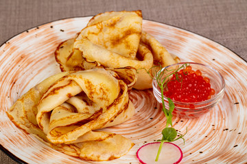 Russian pancakes with red caviar