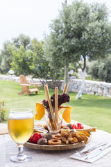 Fresh beer snacks assortment on wooden board