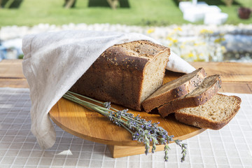 Assortment of baked bread on wooden table background