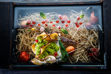 closeup top view on soft white cheese dish on original restaurant plate