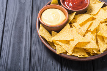 Crispy chips nachos with tomato and cheese sauce