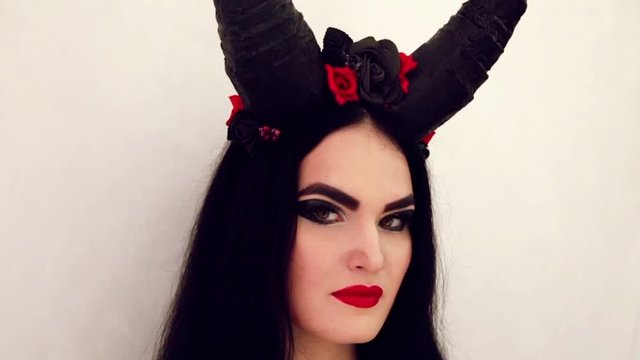 girl in a fairy-tale image with horns on her head