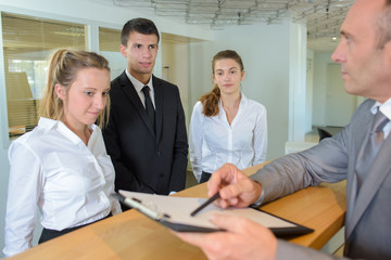 hospitality manager giving instructions to the apprentices
