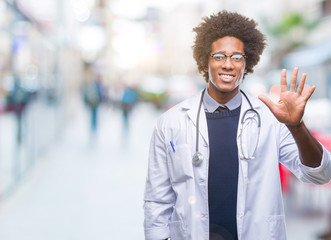 Afro american doctor man over isolated background showing and pointing up with fingers number five while smiling confident and happy.