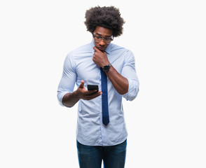 Afro american business man texting using smartphone over isolated background serious face thinking about question, very confused idea