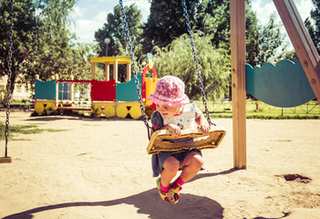 Cute baby playing in the playground