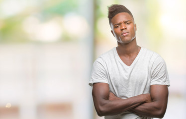 Naklejka na ściany i meble Young african american man over isolated background skeptic and nervous, disapproving expression on face with crossed arms. Negative person.