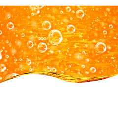 Liquid yellow wave line. Gold bubbles of air. For the project, gold, rest, oil, honey, beer, juice, shampoos or other successful options. On white background an area for text