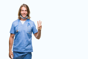 Young handsome doctor man with long hair over isolated background showing and pointing up with fingers number three while smiling confident and happy.