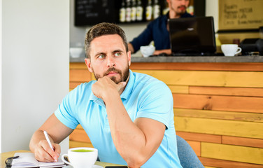 Man bearded dreamy face needs inspiration. Caffeine makes you more energetic. Serious guy enjoy caffeine drink close up. Start day with big cup of coffee. Traditional coffee break cafe background