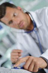 doctor examining health using stethoscope